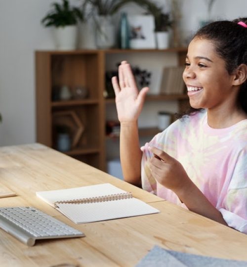 woman-in-pink-shirt-sitting-by-the-table-while-smiling-4143791 (1)